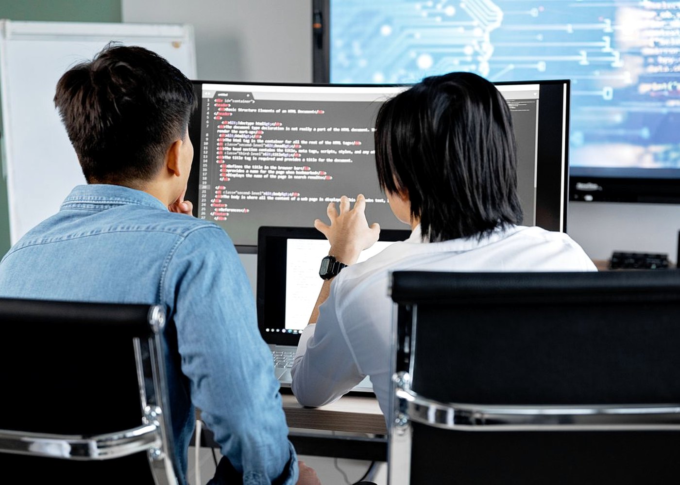 Software engineers working together on a SaaS product